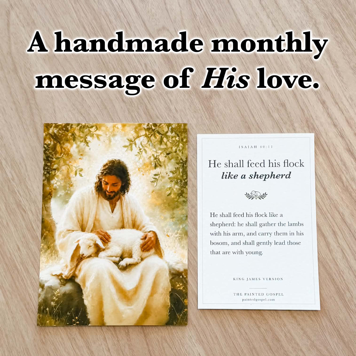 Shepherd’s Care art print and Isaiah 40:11 Scripture card photographed on a light wood surface.