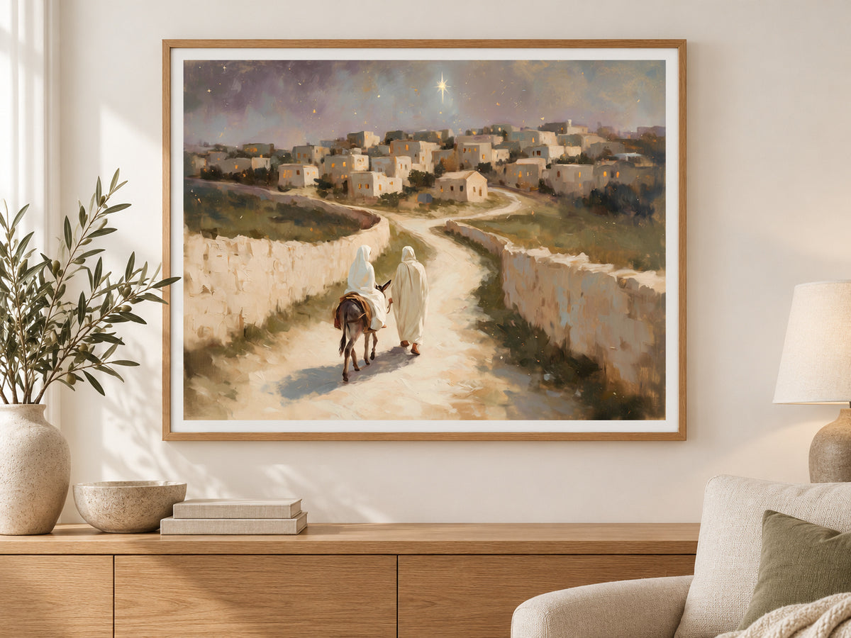 The Road to Bethlehem in a slim oak frame above a console in a sunlit living room