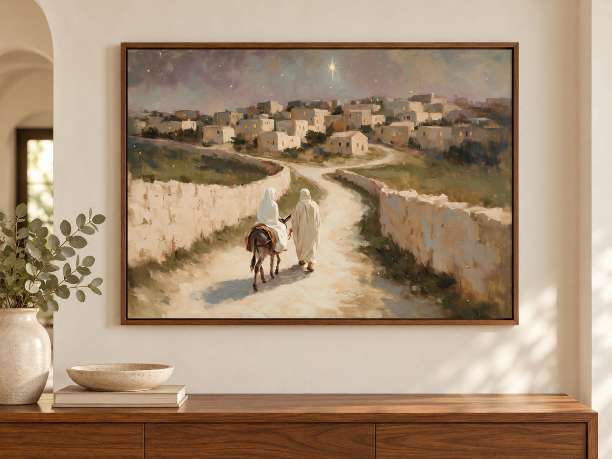 The Road to Bethlehem on canvas in a walnut floating frame above an entry console