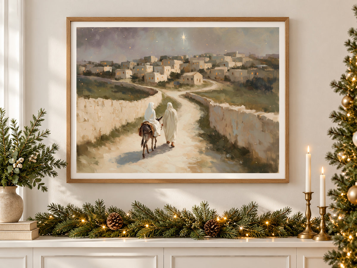 The Road to Bethlehem in an oak frame above a console styled with evergreen and brass for Christmas