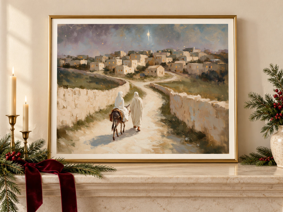 The Road to Bethlehem in a gold frame on a Christmas mantel with greenery and velvet ribbon