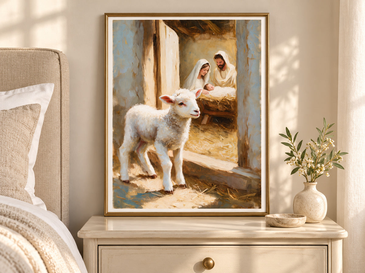 A Lamb Beside the Manger in a slim gold frame in a quiet neutral bedroom