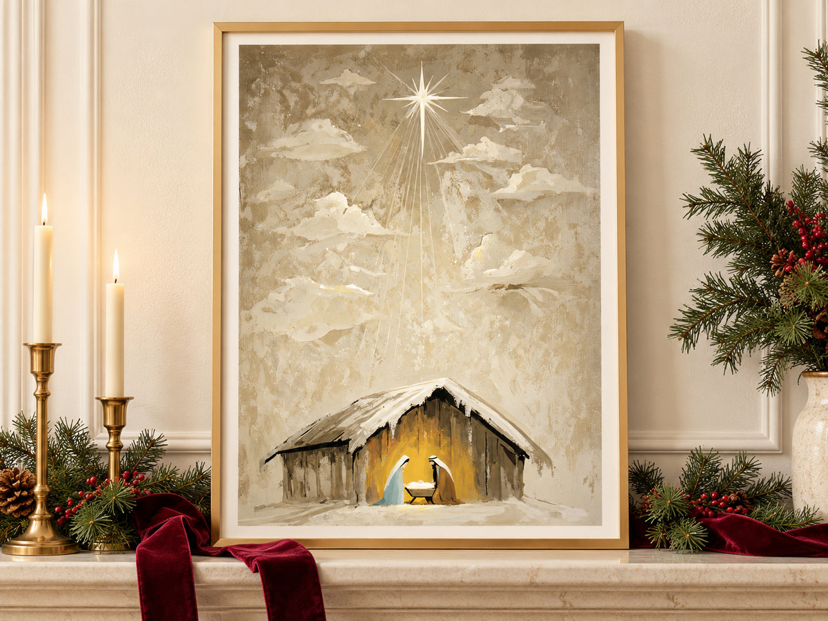 Heaven Came Down #3 in a gold frame on a Christmas mantel with greenery and velvet ribbon