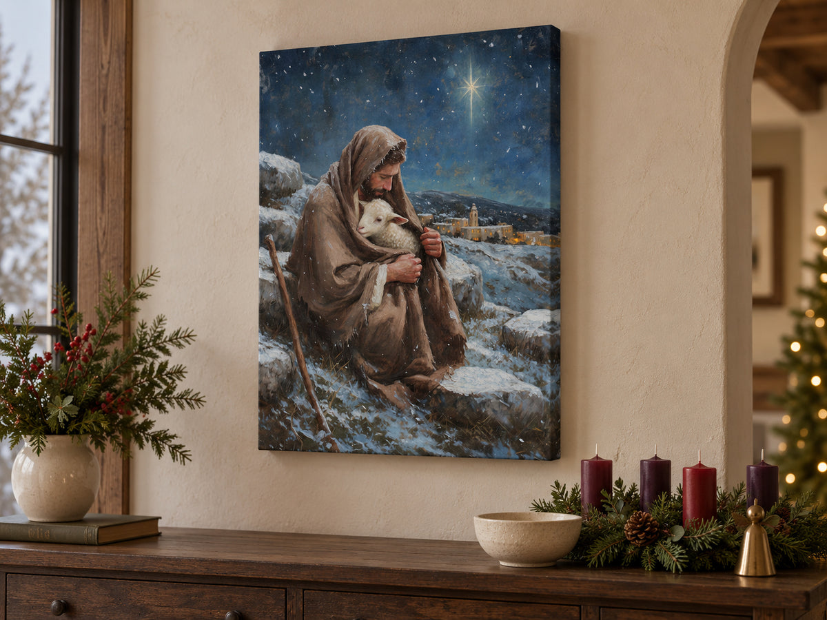 A bearded shepherd holds a white lamb inside his brown cloak on a snowy hillside. A bright star shines in a deep blue sky above a village with warm windows. Shown as a vertical canvas print in christmas canvas advent console setting.