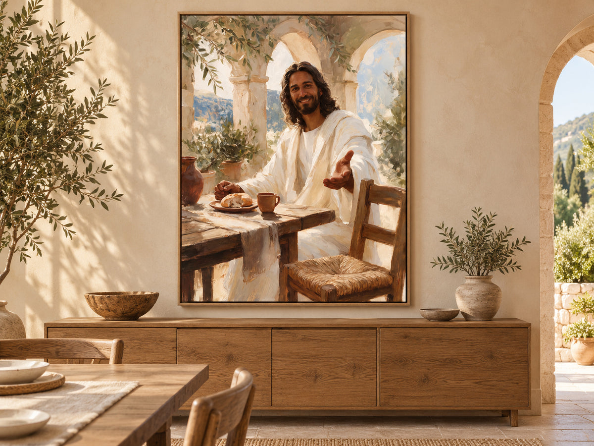 Come to the Table canvas in an oak floating frame beside a sunlit dining table with relaxed linen and olive foliage.